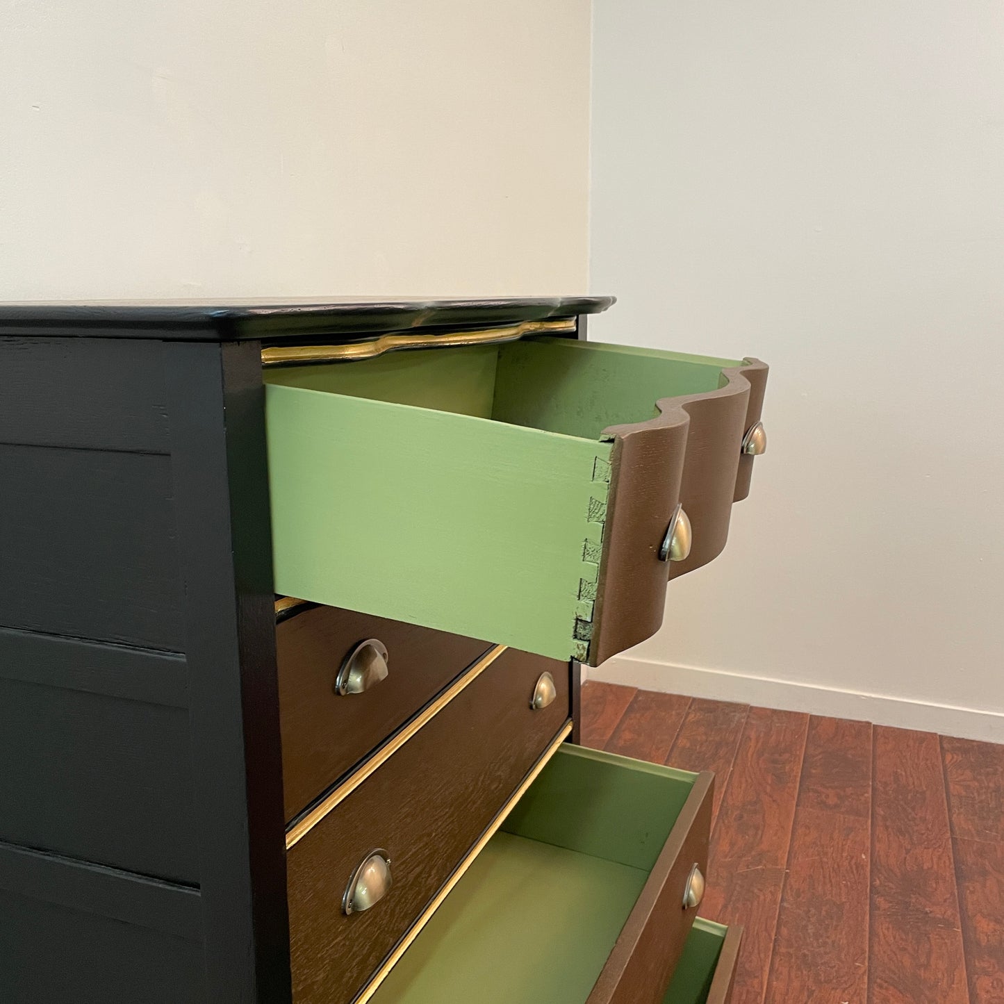 Serpentine Black and Gold Dresser