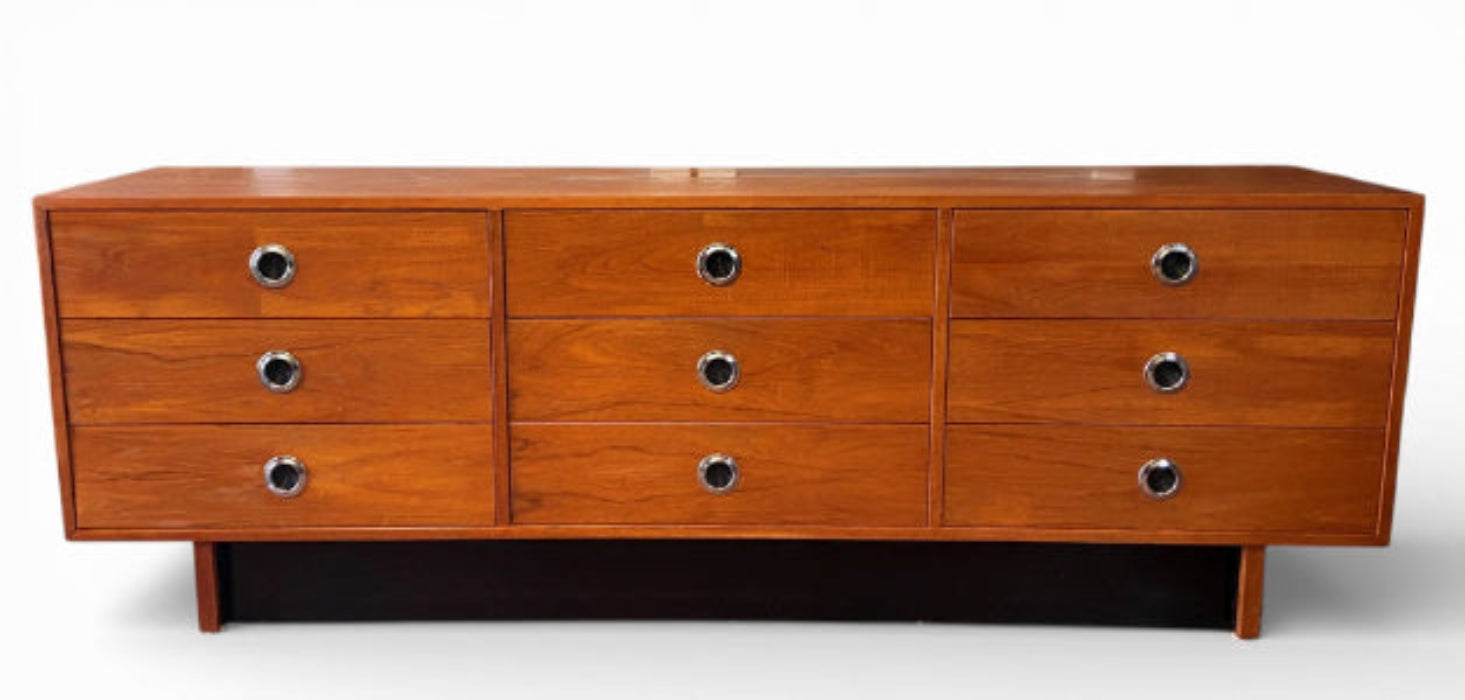 Wooden dresser with multiple drawers on a white background