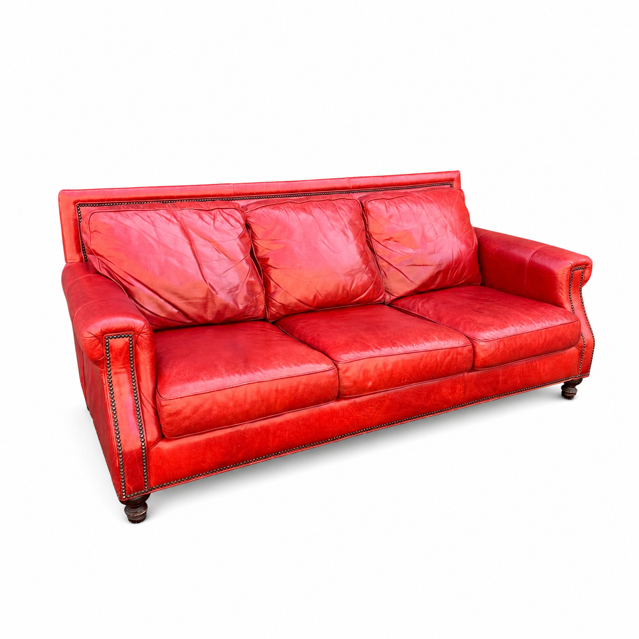 Bradington-Young red leather sofa on a white background - angled view