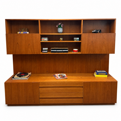 1960s Danish teak wall unit on a white background, front view