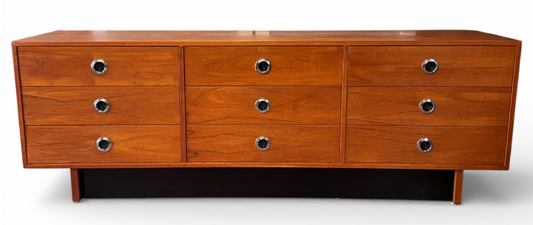 Wooden dresser with matching queen bed and nightstands on a white background