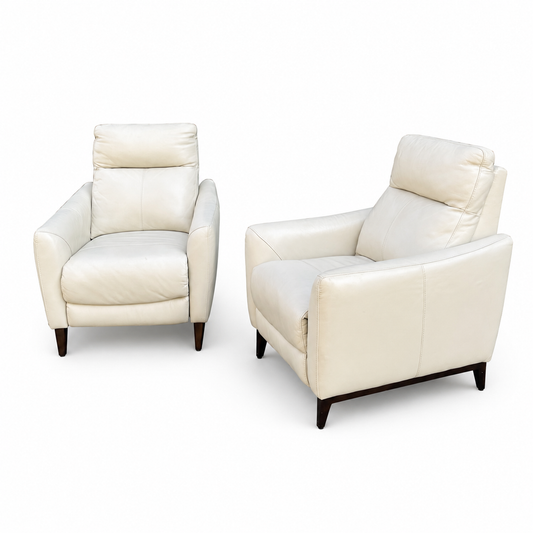Set of two Gilman Creek cream leather pushback recliners