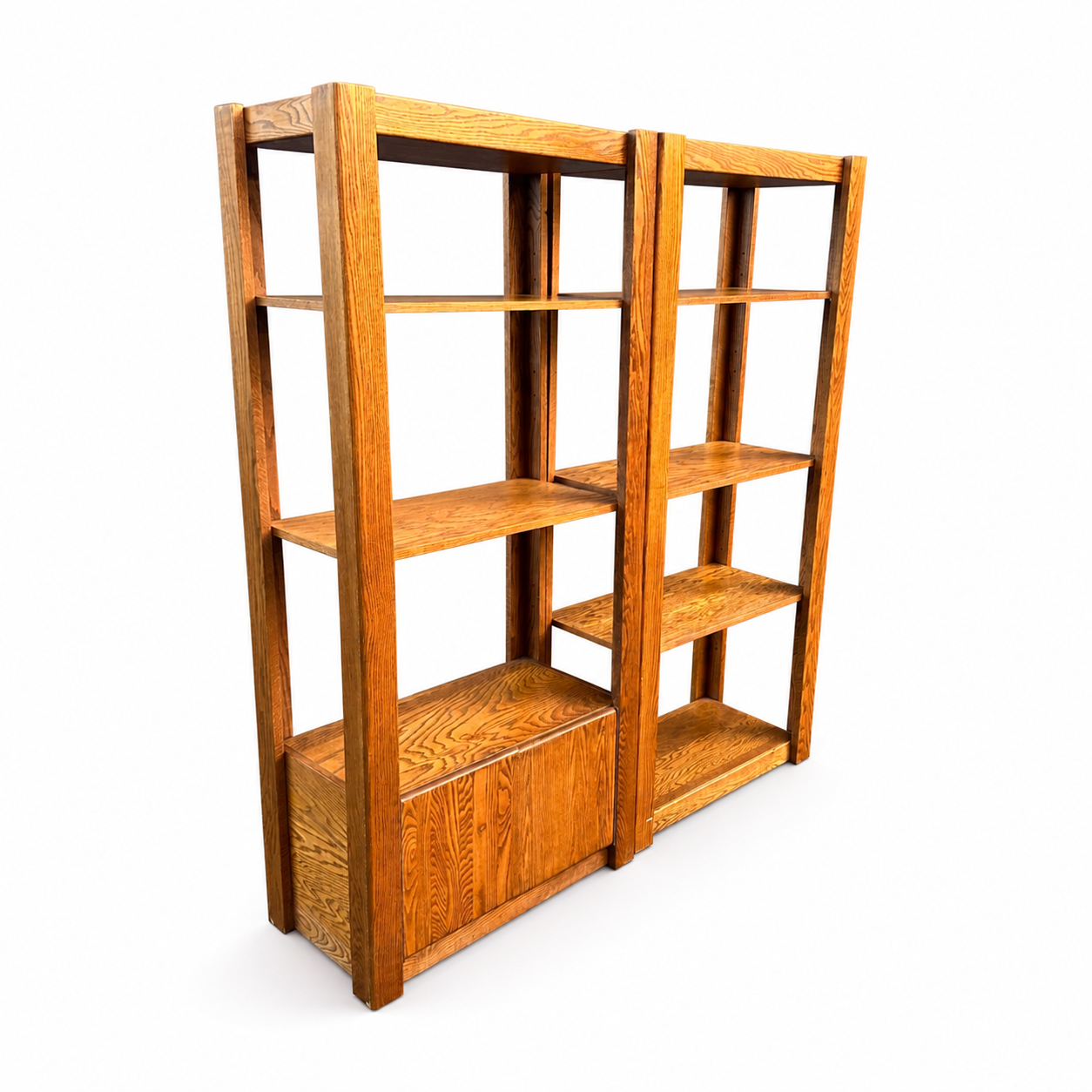 Pair of vintage oak shelving units on white background